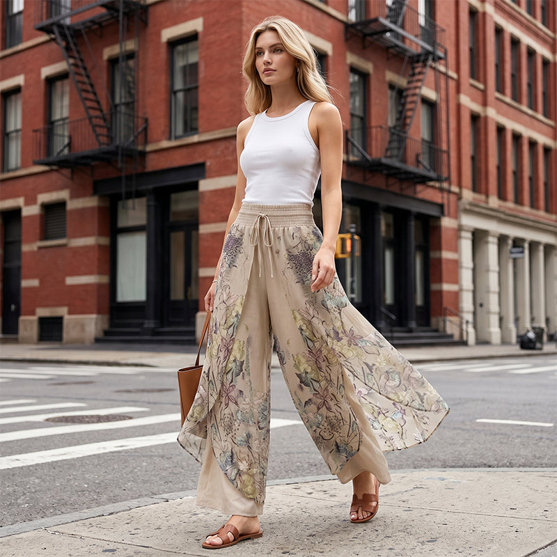 Women's printed wide-leg drawstring trousers by Arenzza, featuring a flowy fabric and stylish design, shown on a model.