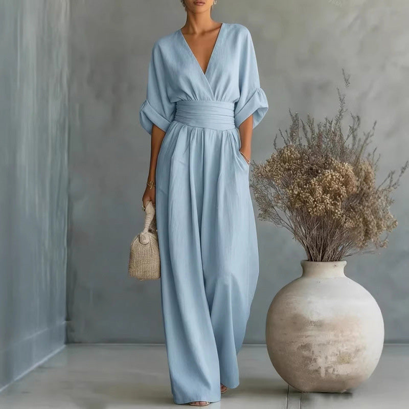 Aarenza women's V-neck high waist wide-leg jumpsuit in black, displayed on a hanger with a clean background.