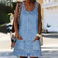 Women's casual denim pinafore dress by Arenzza featuring a fitted bodice and flared skirt, styled with shoulder straps and front pockets.