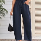 A pair of Arenzza drawstring pocket Capri sweatpants featuring a relaxed fit, elastic waistband, and side pockets.