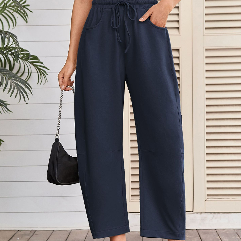 A pair of Arenzza drawstring pocket Capri sweatpants featuring a relaxed fit, elastic waistband, and side pockets.
