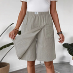 Women's casual elastic waist wrap skort by Arenzza, featuring a stylish design, comfortable fit, and versatile clothing for everyday wear.