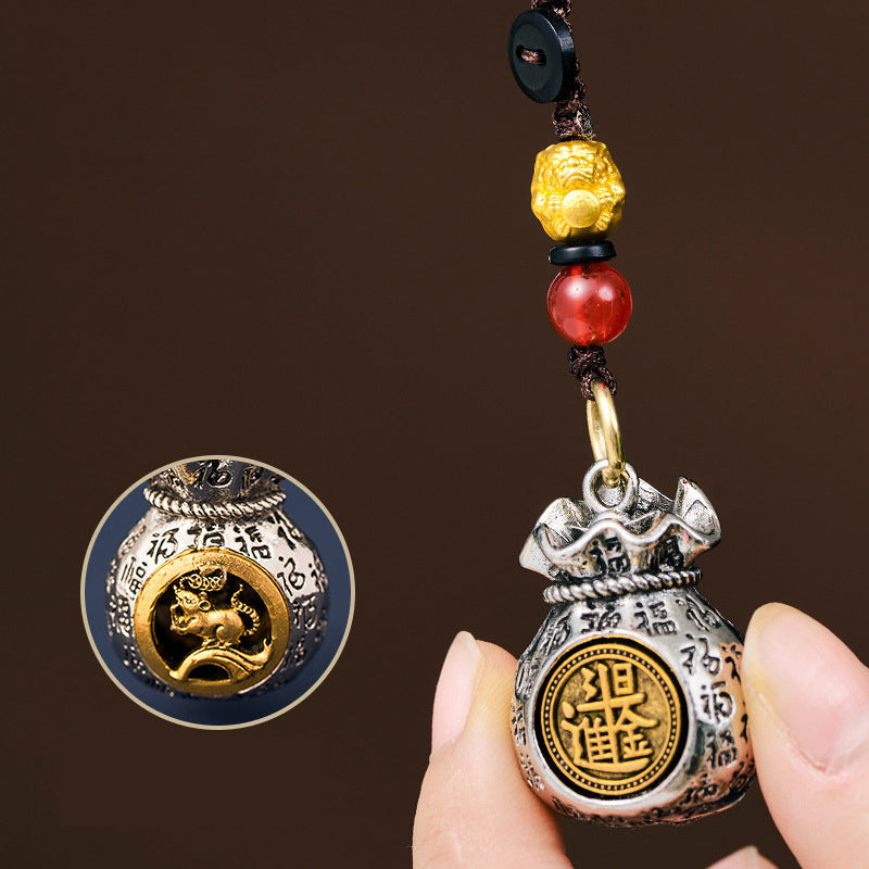 Arenzza zodiac fortune bag pendant with festive Christmas design, symbolizing good luck and prosperity, displayed against a neutral background.