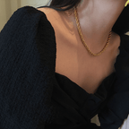 Gold layered twist rope necklaces and bracelets by Arenzza, featuring elegant, intertwined jewelry designs with a shiny finish.