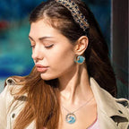 Elegant blue necklace, ring, and earrings set by Arenzza featuring matching jewelry with a sophisticated design.