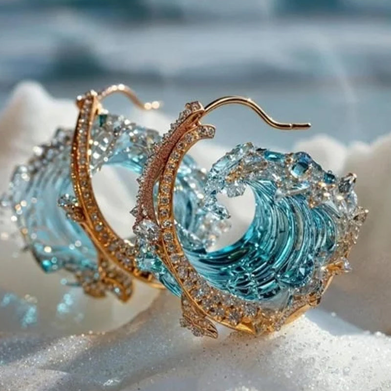 Elegant blue necklace, ring, and earrings set by Arenzza featuring stylish jewelry pieces on a neutral background.