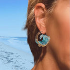 Elegant blue necklace, ring, and earrings set by Arenzza featuring stylish jewelry with blue accents and intricate design.