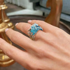 Elegant blue necklace, ring, and earrings set by Arenzza featuring coordinated jewelry with intricate details.