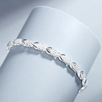 Elegant blue necklace, ring, and earrings set from Arenzza featuring coordinated jewelry pieces with intricate design.