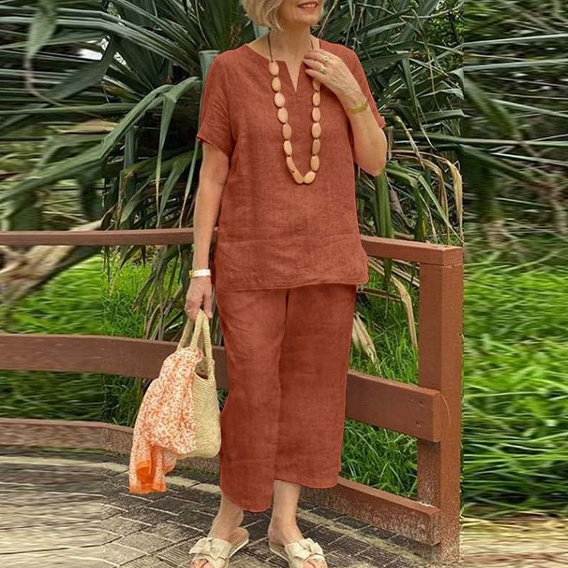 A woman wearing Arenzza women's casual top and pants 2-piece set, stylish and comfortable clothing for everyday wear.