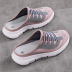A pair of breathable closed-toe slide slippers from Arenzza, designed for comfort and casual wear in a natural, relaxed setting.