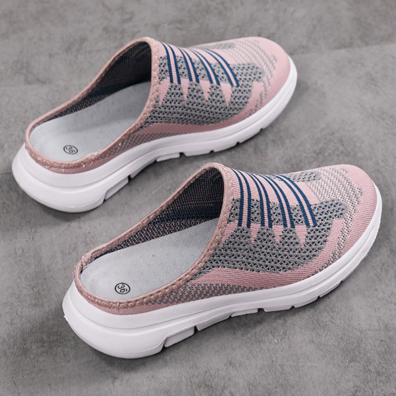 A pair of breathable closed-toe slide slippers from Arenzza, designed for comfort and casual wear in a natural, relaxed setting.