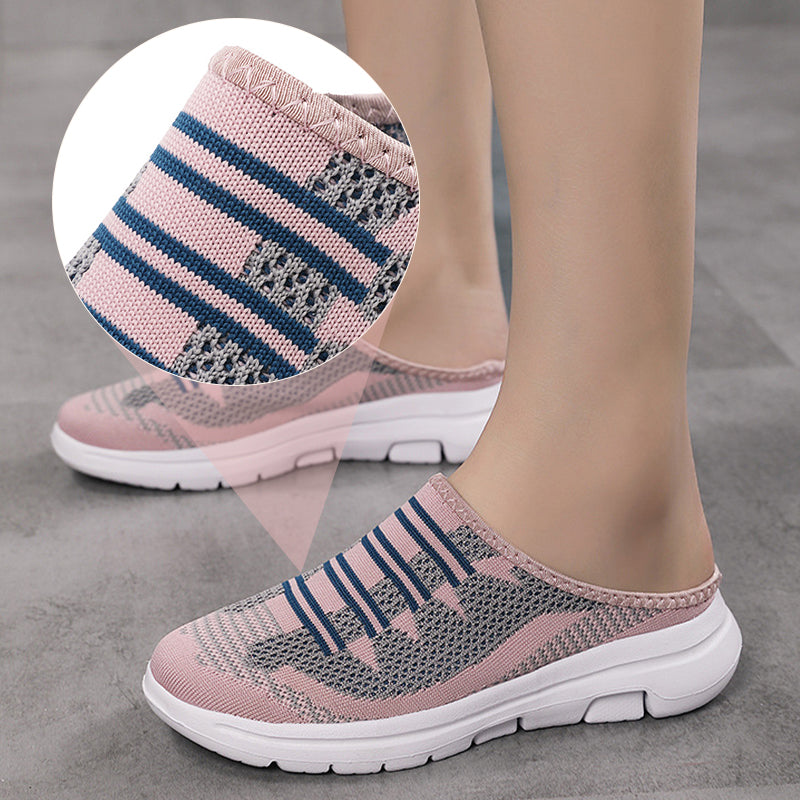 A pair of Arenzza breathable closed-toe slide slippers with soft fabric upper and cushioned sole for comfort.