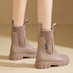 A pair of black Arenzza waterproof, non-slip mid-calf boots with thick soles, suitable for outdoor and rainy conditions.