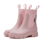 A pair of Arenzza waterproof non-slip thick sole mid-calf boots with sturdy design and matte finish, suitable for outdoor wear.