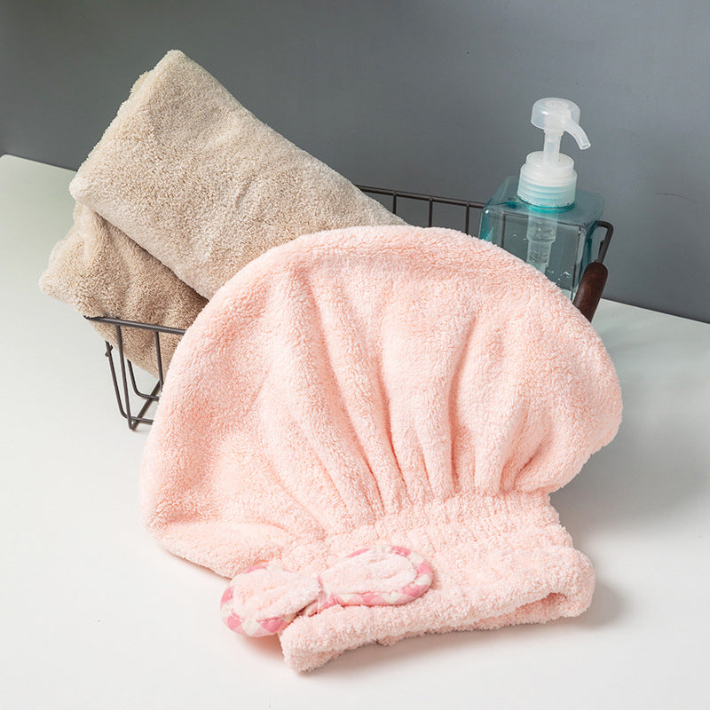 A coral fleece hair turban by Arenzza, shown in a soft, plush fabric, designed for hair drying and styling.