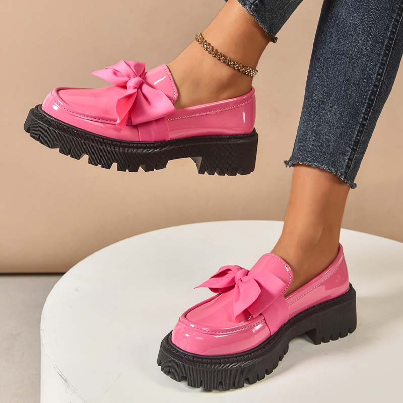 A pair of Arenzza chic sweet platform loafers with bows in purple, featuring a stylish, comfortable design.