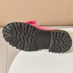 A pair of Arenzza chic pink platform loafers with bows, stylish and trendy footwear for women.