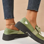A pair of Arenzza chic sweet platform loafers with bows in purple, featuring a stylish and trendy footwear design.