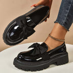 A pair of Arenzza chic sweet platform loafers with bows in purple, showcasing stylish footwear on a plain background.
