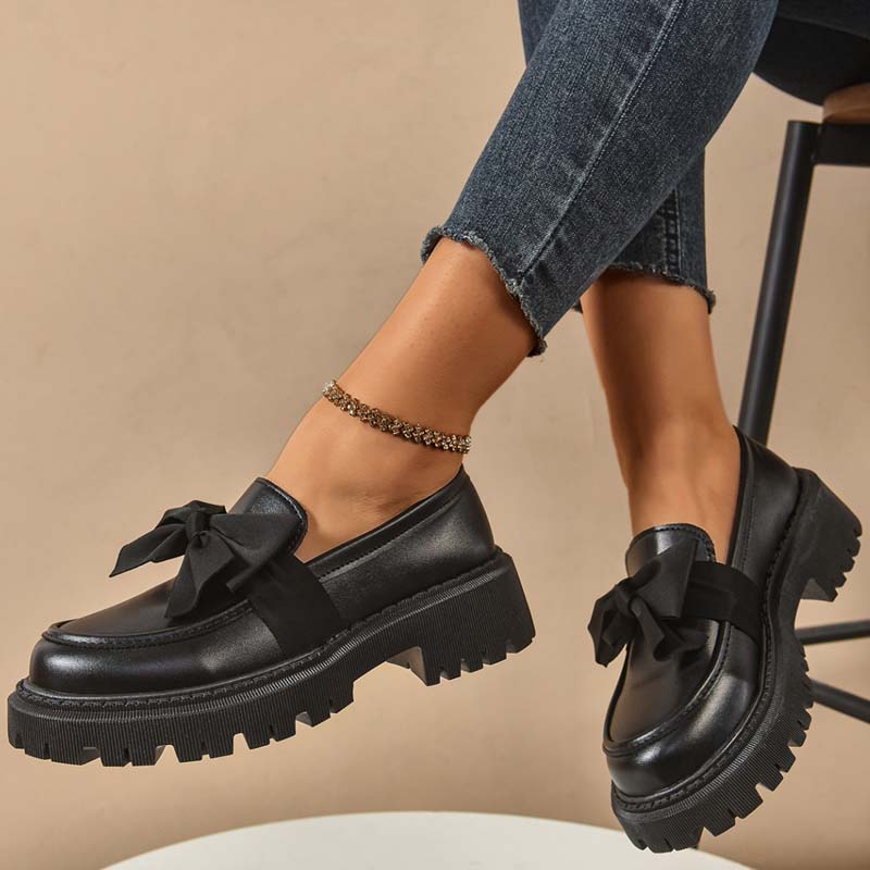A pair of Arenzza chic sweet platform loafers with bows in purple, featuring a stylish design and comfortable slip-on style.