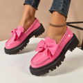 A pair of Arenzza chic sweet platform loafers with bows, featuring a stylish design and comfortable slip-on style.