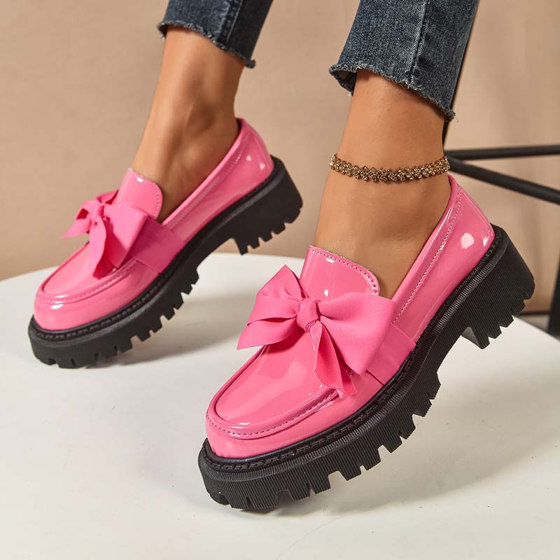 A pair of Arenzza chic sweet platform loafers with bows, featuring a stylish design and comfortable slip-on style.