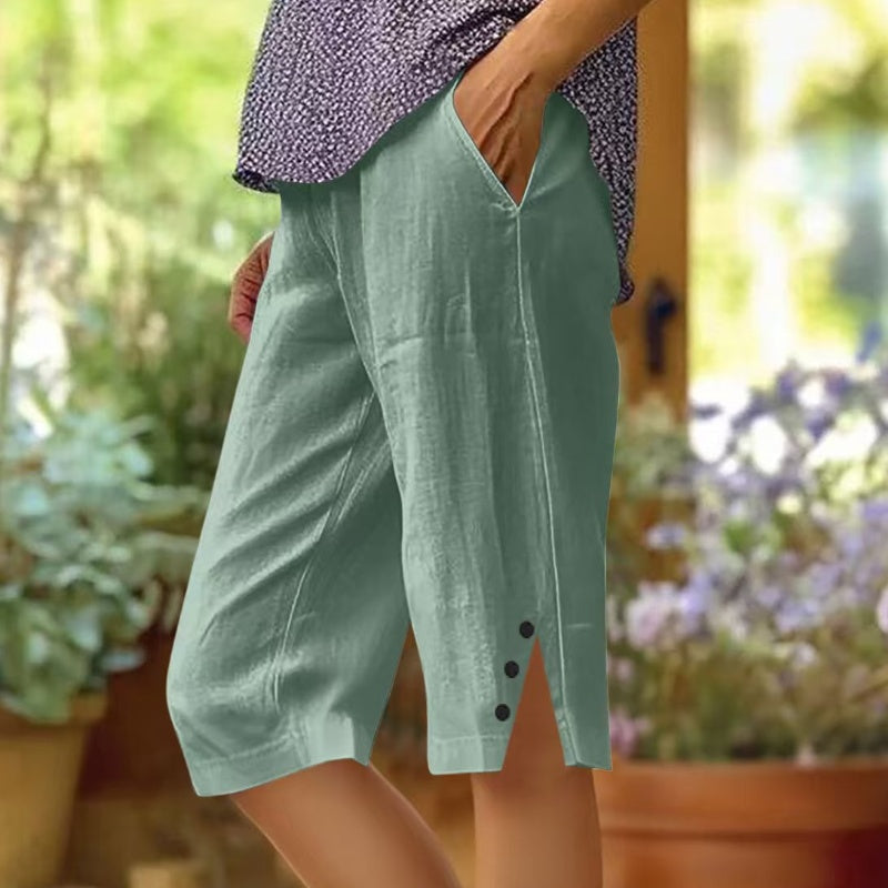 A pair of women's casual solid color pocket Capri pants by Arenzza, showing the relaxed fit and comfortable design.