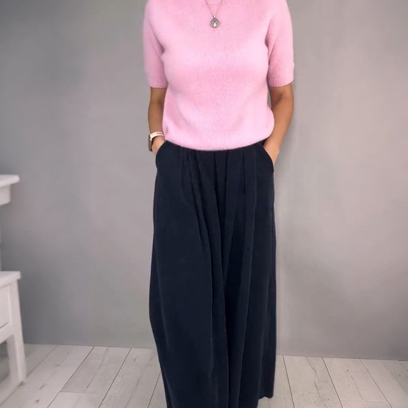 A woman wearing the Arenzza Comfort Chic knit top and wide-leg pants set, showcasing a cozy, stylish clothing outfit.