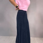 A model wearing the Arenzza Comfort Chic knit top and loose wide-leg pants set, featuring soft fabric and relaxed fit.