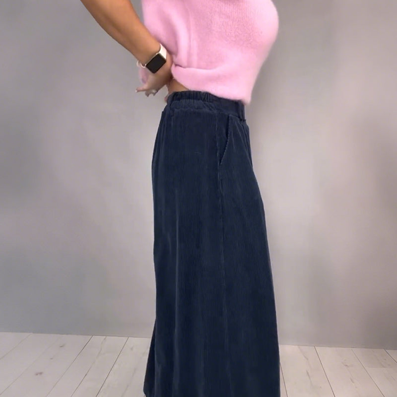 A model wearing the Arenzza Comfort Chic knit top and loose wide-leg pants set, featuring soft fabric and relaxed fit.