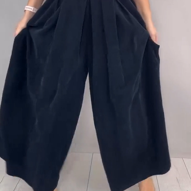 A woman wearing the Arenzza Comfort Chic knit top and loose wide-leg pants set, featuring a cozy, stylish outfit.