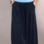 A woman wearing the Arenzza Comfort Chic knit top and loose wide-leg pants set, showcasing a relaxed and stylish outfit.
