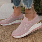 A pair of Arenzza women's rhinestone slip-on sneakers with mesh fabric, showcasing their shiny, casual, and comfortable design.