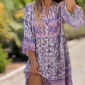 Women floral V-neck dress by Arenzza featuring a vibrant floral pattern and flowing fabric, perfect for spring and summer wear.