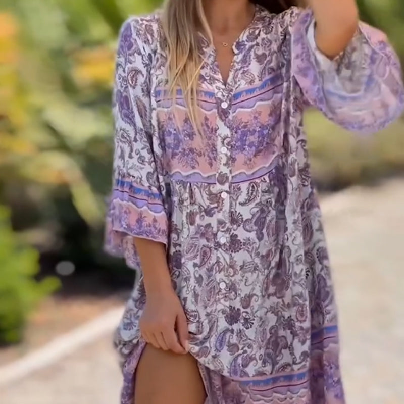 Women floral V-neck dress by Arenzza featuring a vibrant floral pattern and flowing fabric, perfect for spring and summer wear.