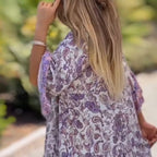 Women floral V-neck dress by Arenzza featuring a colorful floral pattern and flowing fabric, perfect for spring and summer wear.