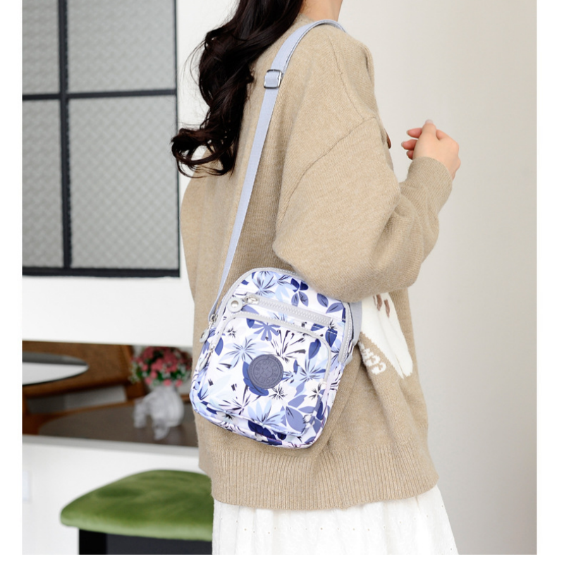 Aarenza lightweight fashion bag with multi-pocket design, featuring sleek style and practical compartments for accessories.