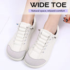 A pair of women’s wide toe casual sneakers by Arenzza featuring comfortable design and neutral color for everyday wear.