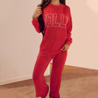 Arenzza festive stripe long-sleeve top and drawstring wide-leg pants set, featuring colorful holiday-themed patterns.
