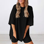 A woman wearing Arenzza women's summer casual loose two-piece set, featuring a light, breathable fabric perfect for warm weather.