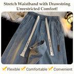 A pair of men's loose straight jeans by Arenzza, shown hanging with a focus on the denim fabric and relaxed fit.