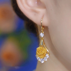 Elegant mesh rose earrings by Arenzza featuring intricate floral design and silver-tone hooks.