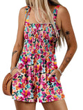 A woman wearing a sleeveless, loose summer romper with a square neckline and smocked waist, in a casual style by Arenzza.
