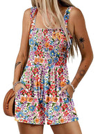 A women's sleeveless summer romper with a square neck, loose fit, smocked waist, in a casual style by Arenzza.