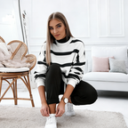 Women's striped sports set by Arenzza, 2-piece activewear with a modern design, featuring a comfortable sports top and matching leggings.