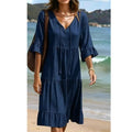 A women's V-neck tassel tie tiered midi dress by Arenzza, featuring a flowy silhouette and layered fabric in a stylish design.