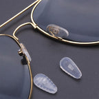 Arenzza eyeglass nose pad repair kit with replacement nose pads and tools for repairing and replacing eyewear nose pads.