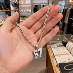 Arenzza 67 number pendant necklace featuring a bold, metallic number pendant on a sleek chain, perfect for fashion-forward accessories.