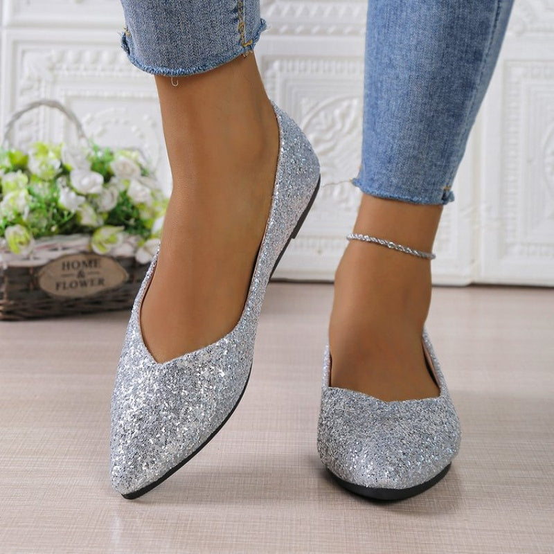 Women's glitter pointed toe flats by Arenzza, showcasing shiny glitter fabric and sleek pointed toe design.